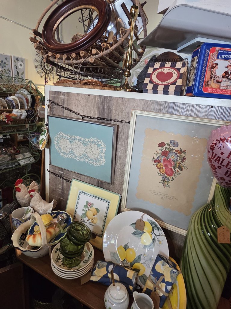 A unique assortment of handpicked household goods such as frames, plates, home decor, and baskets.