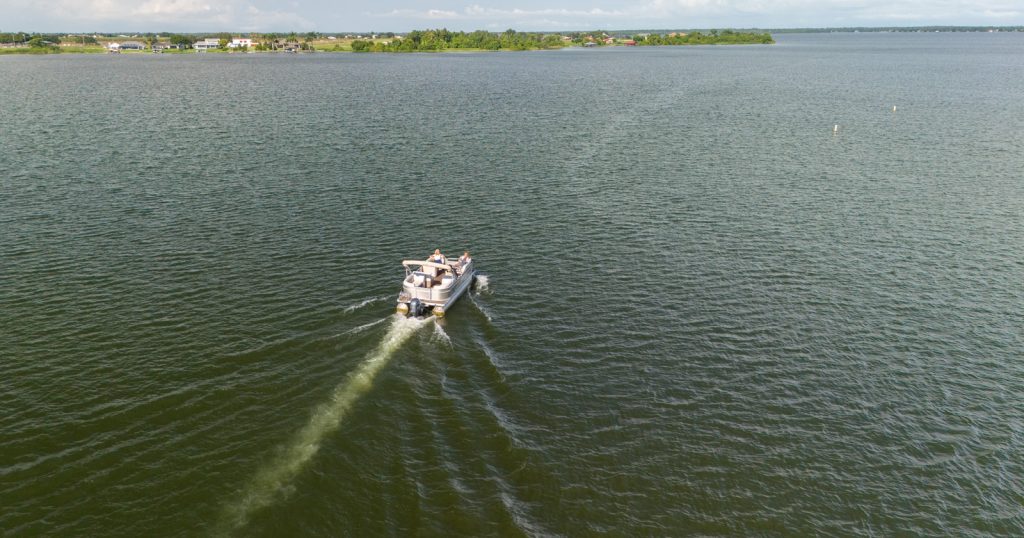 Pontoon boat on Lake Placid in June