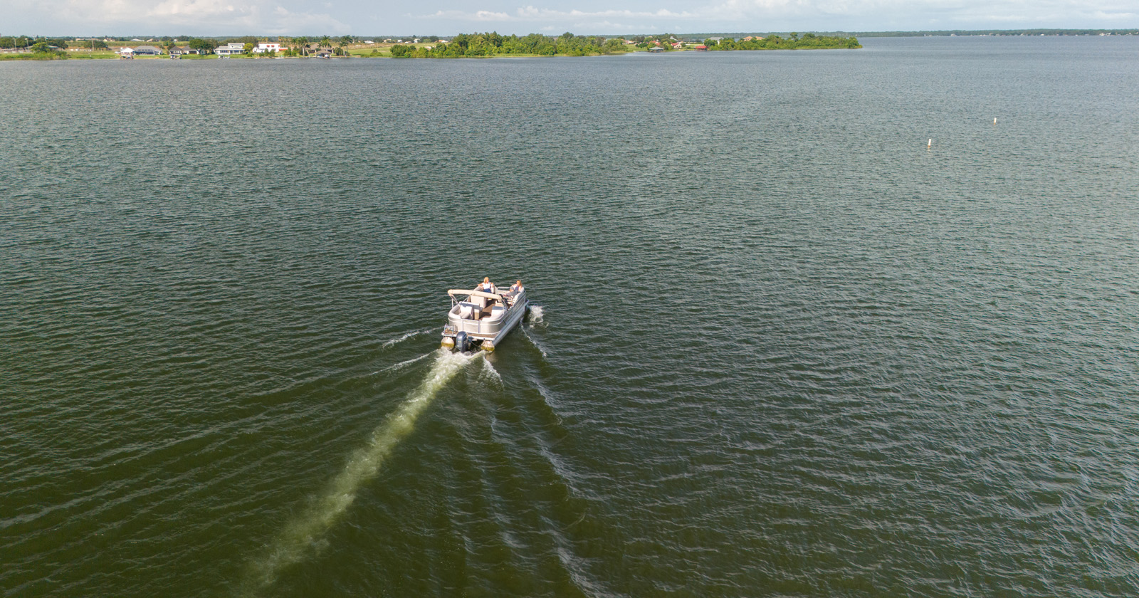 Pontoon boat on Lake Placid in June