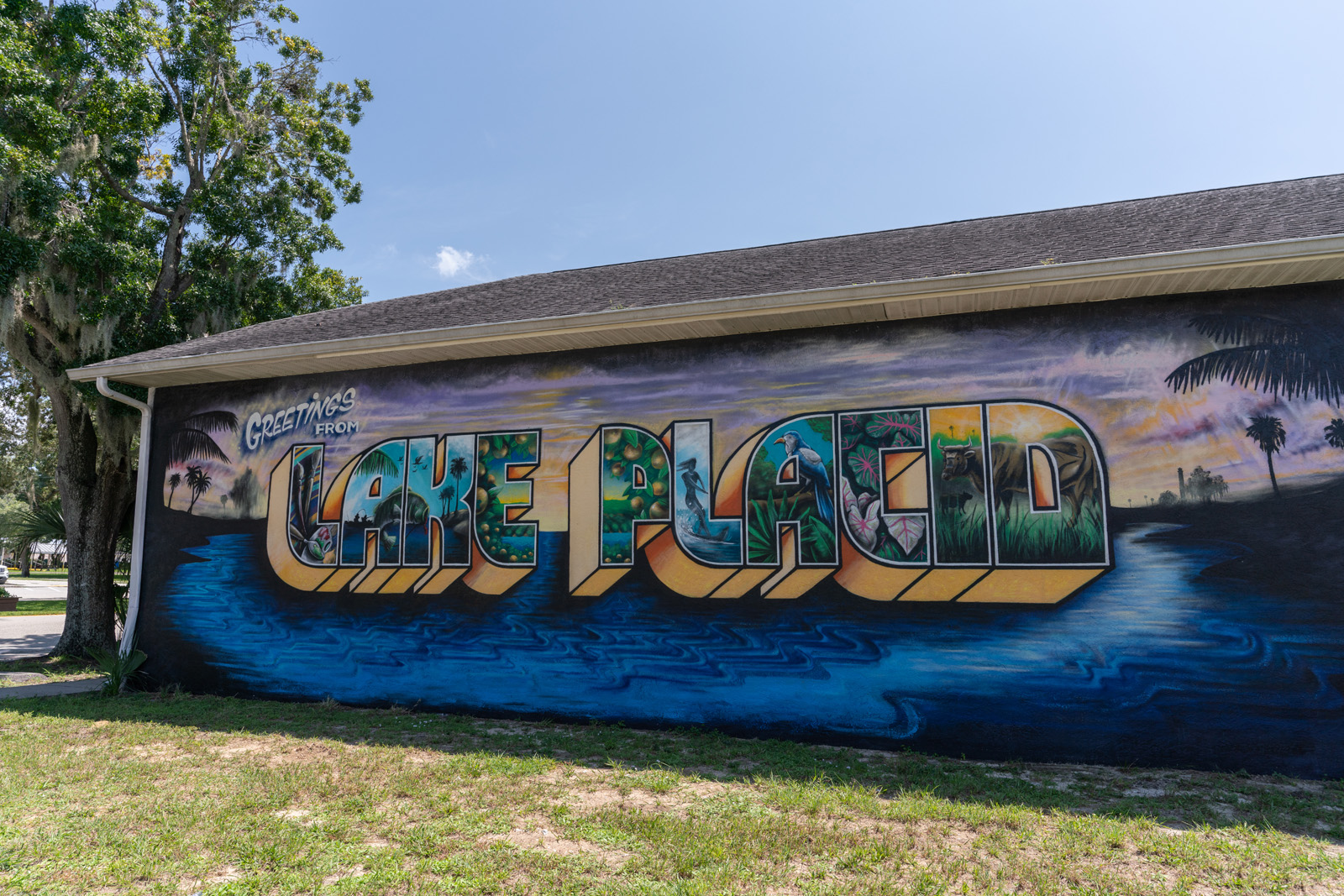 Welcome postcard mural on the side of a building in Highlands County, Lake Placid, Florida