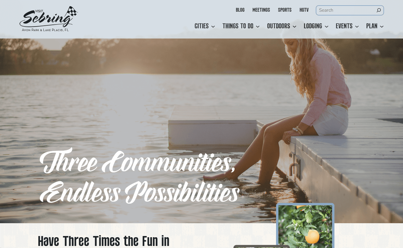 Home Page of VisitSebring.com showing the top navigation bar, a photo of a young woman sitting on a dock with her feet in the water against a setting sun, and test boasting "three communities, endless possibilities" in the Sebring, FL area