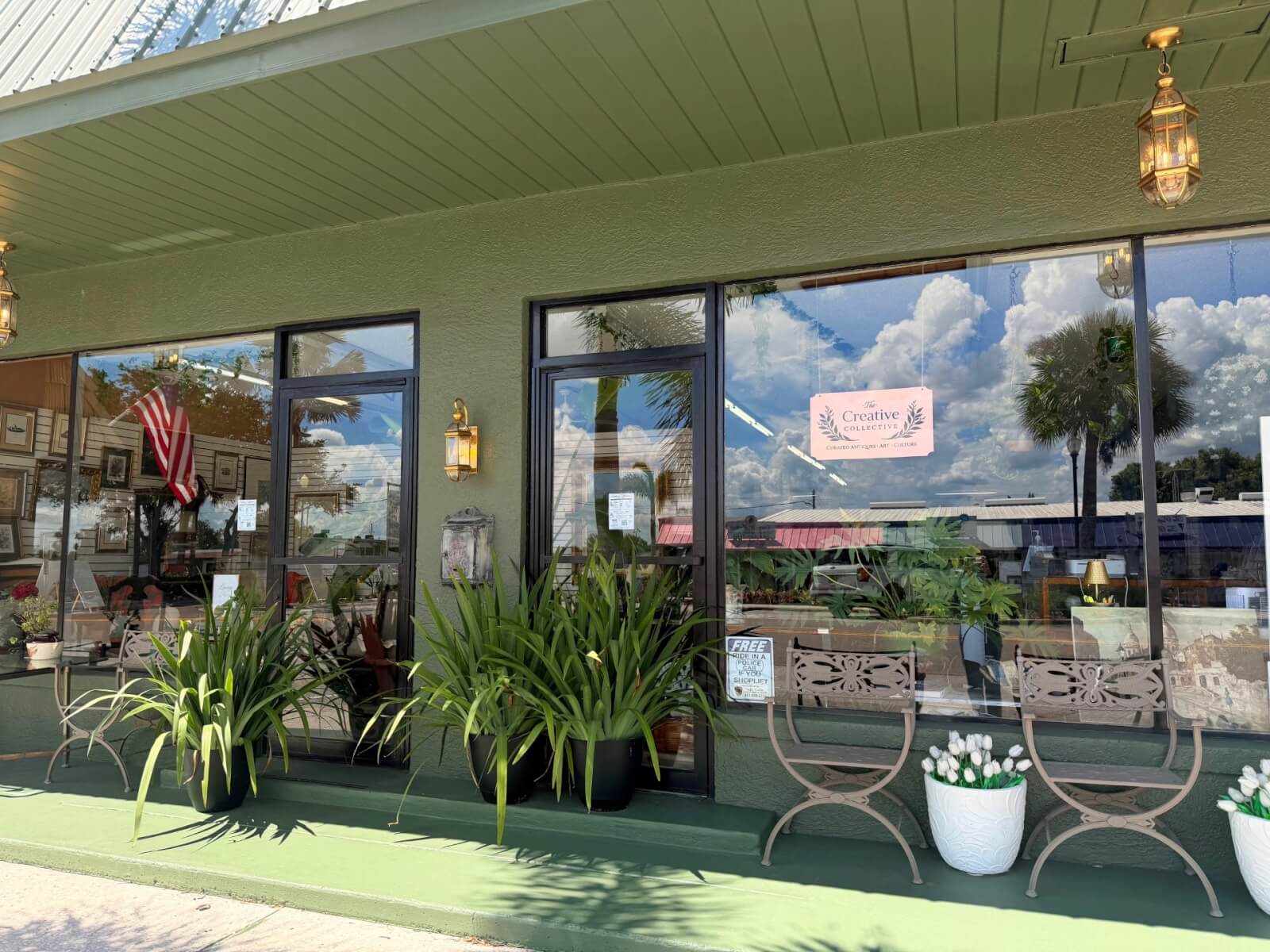 creative collective 1-visit-sebring-fl Outside exterior of storefront, featuring a green painted storefront and plants outside lining the large display windows