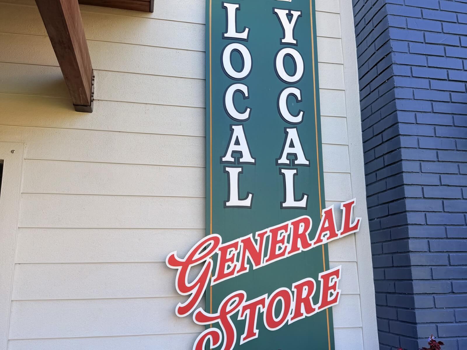 Red and green signage displaying store name advertising the general store located in Lake Placid, Florida.