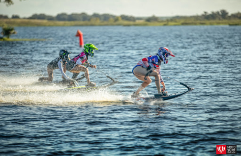 Women racing motoriazed surf boards in MotoSurf race