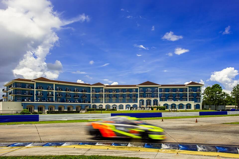 seven hotel blurred car on track 1-visit-sebring-fl